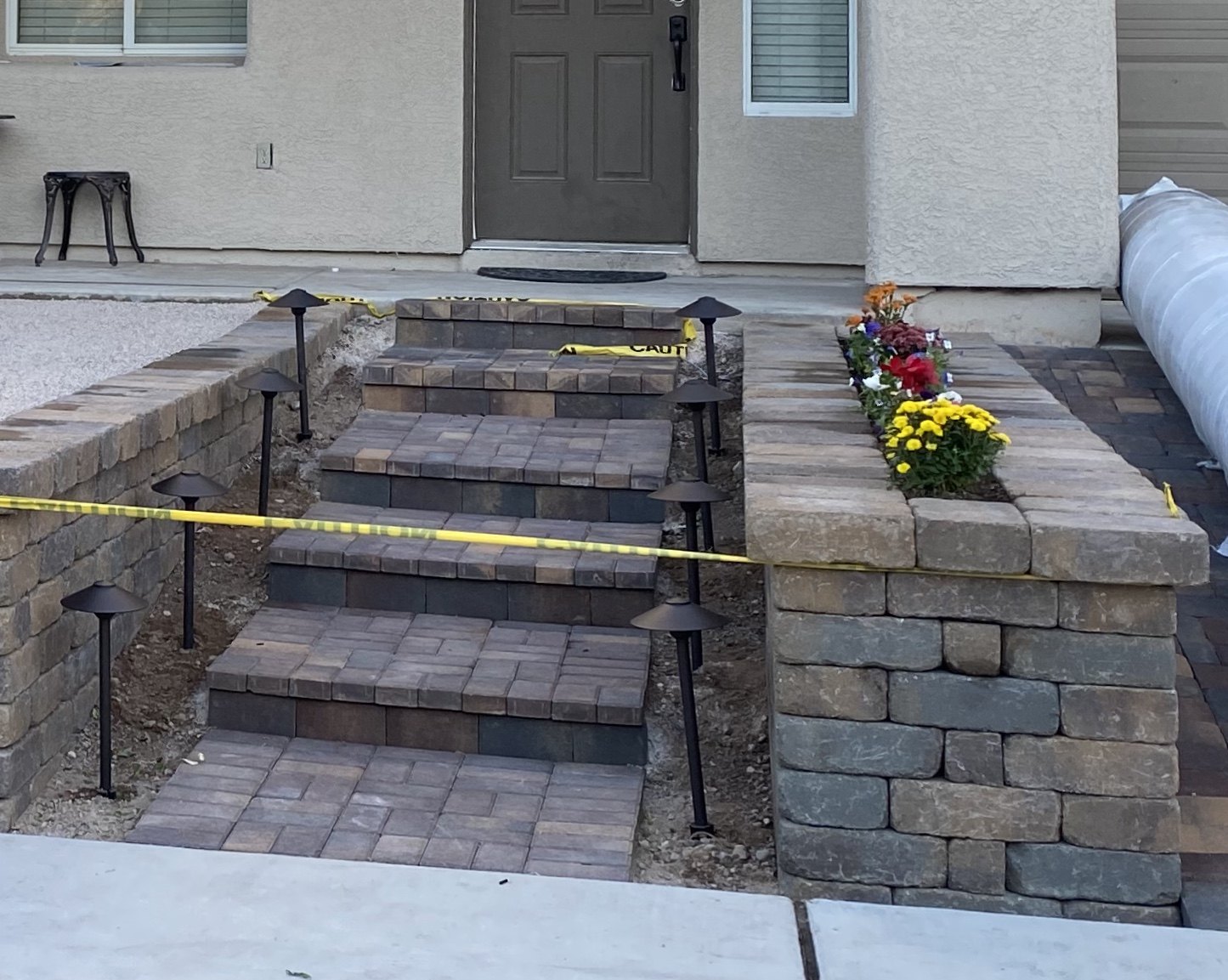 Front entry steps with block and stone planter