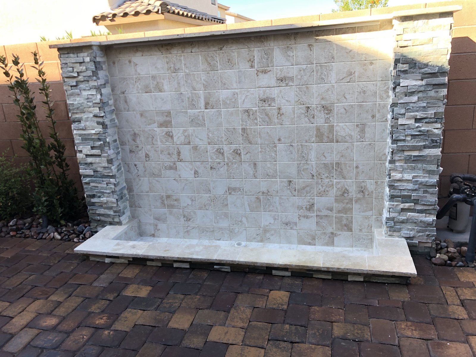 Tile and stone outdoor water feature wall